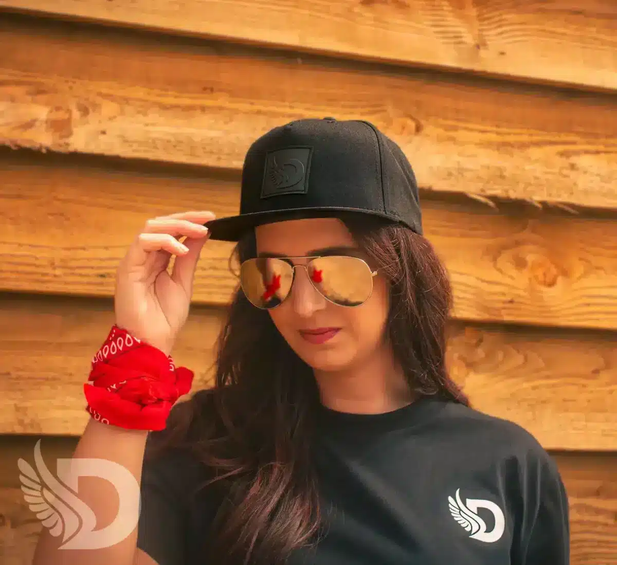 Woman wearing the DROW Black Snapback hat with Rubber D patch