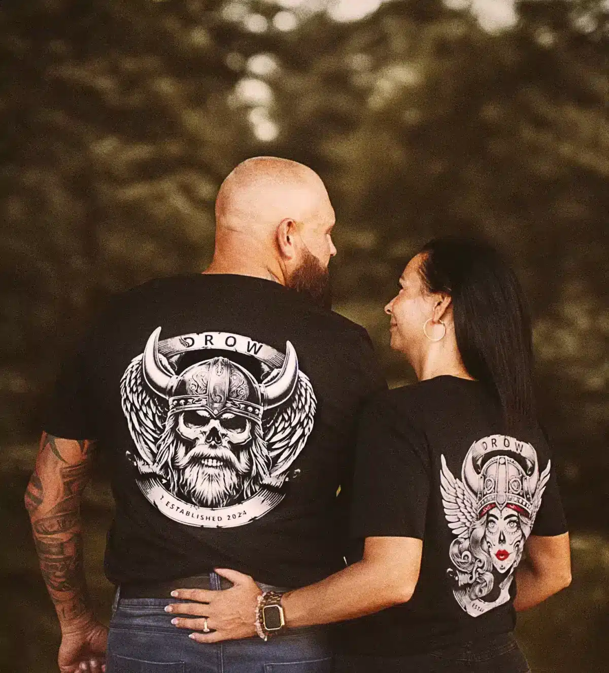 Couple wearing the DROW Rebel Valkyrie and the DROW Warrior T-Shirts with a bold statement of resilience and strength, fierce independence and rebellious attitude