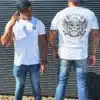 2 Men wearing the white DROW Warrior T-Shirts with a bold statement of resilience and strength.