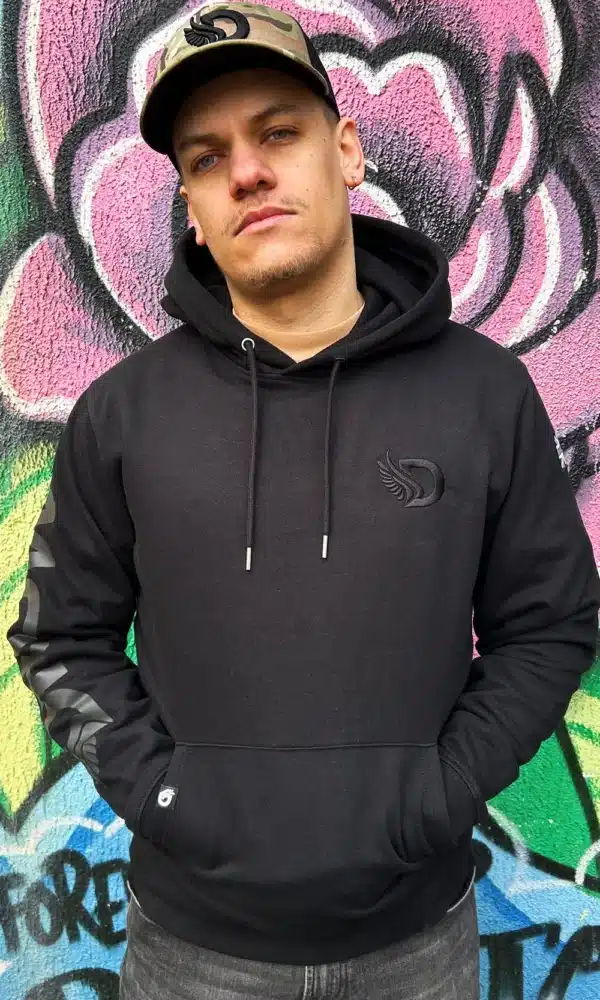 Man standing wearing the DROW Graphite Big D Hoodie